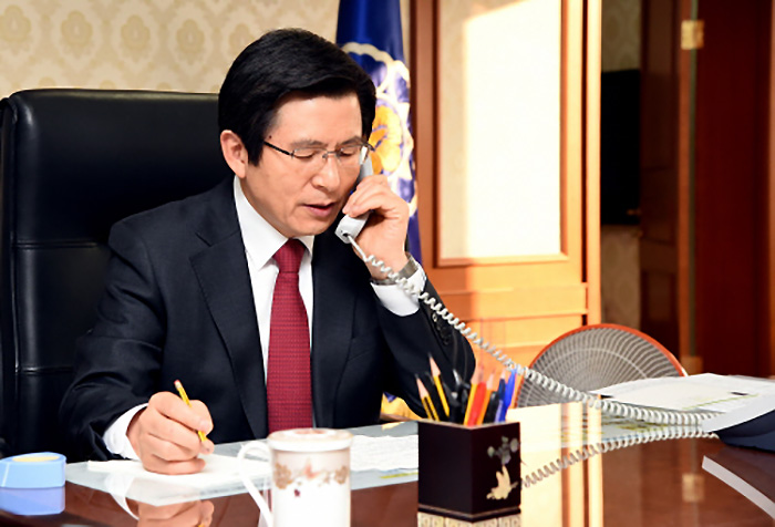 South Korea's Acting President and Prime Minister Hwang Kyo-ahn speaks with U.S. President Donald Trump over the phone at his office in Seoul on Jan. 30, 2017, in this photo, released by the Prime Minister's Office.